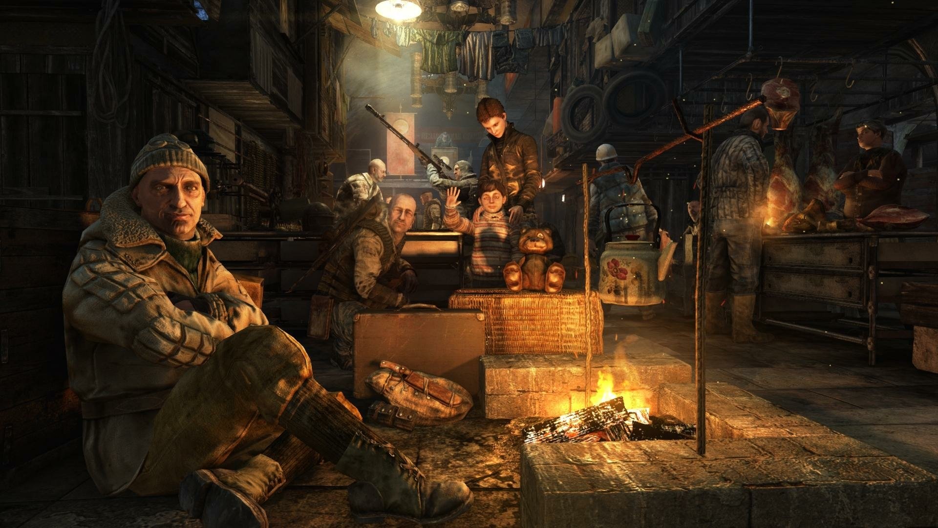 HD PC desktop wallpaper of Metro Last Light Redux: armed survivors huddle around a fire in a dim underground tunnel, surrounded by crates, gear and a grim post‑apocalyptic atmosphere.
