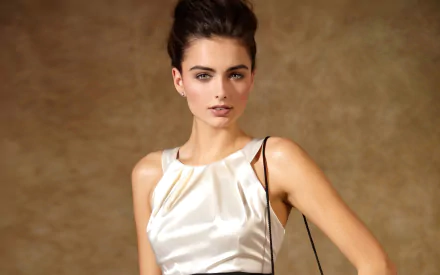 HD PC desktop wallpaper of a brunette model woman in a satin white dress against a warm brown backdrop (subject identity not specified).