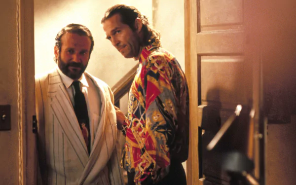 HD wallpaper featuring a scene from The Fisher King with a character portrayed by Robin Williams standing next to another character.