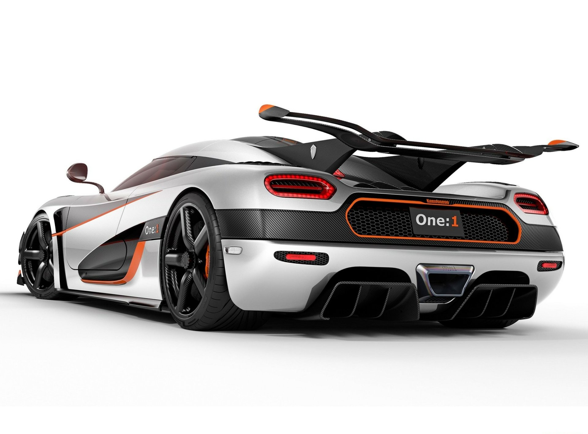 HD desktop wallpaper featuring a sleek silver Koenigsegg Agera One:1 sports car, showcasing its aerodynamic design and rear details against a white background.