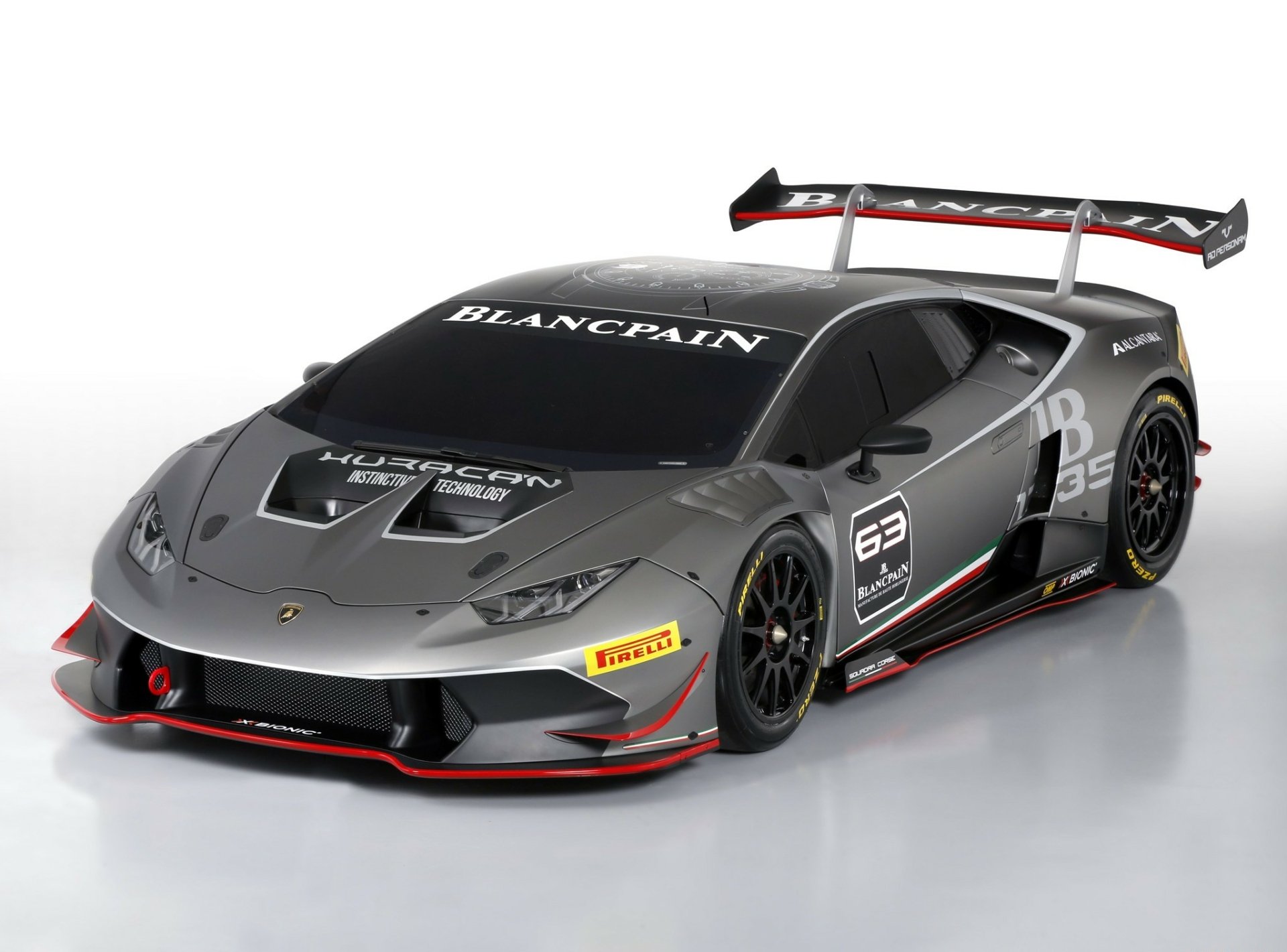 A sleek Lamborghini Huracan supercar, featuring a striking design with aerodynamic details and a prominent rear wing, serves as an impressive HD desktop wallpaper.