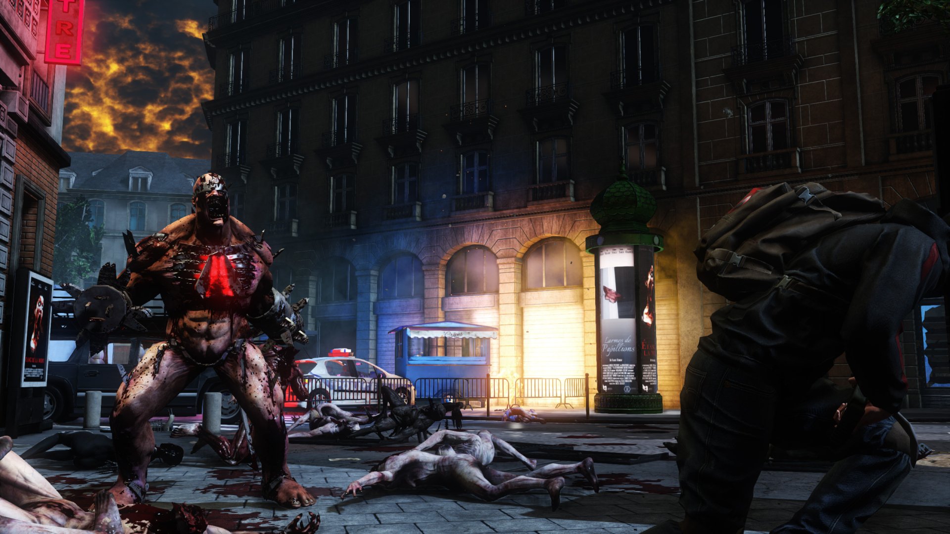 HD PC desktop wallpaper from the video game Killing Floor 2, depicting a tense urban battle scene with a monstrous creature and armed survivors at night.