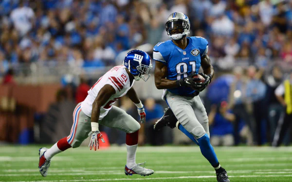 Detroit Lions receiver in blue makes a catch and sprints upfield as a defender closes in on stadium turf — HD PC desktop wallpaper, sports action background.