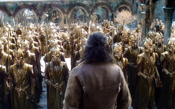 HD PC desktop wallpaper from the movie The Hobbit: The Battle of the Five Armies, featuring a scene of armored soldiers standing in formation facing a lone figure.