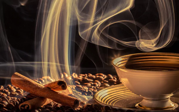 A steaming cup of coffee sits among coffee beans and cinnamon sticks, creating a warm and inviting atmosphere in this HD desktop wallpaper.
