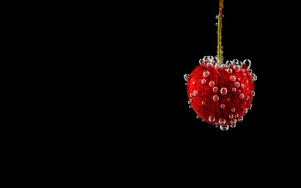 A vibrant cherry surrounded by bubbles against a black background, capturing the essence of freshness and indulgence. An eye-catching HD wallpaper showcasing fruit and elegance.
