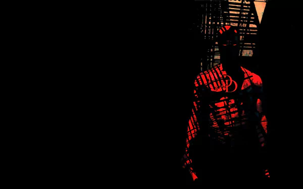 Comic Daredevil in red shadow stands by a fire escape on the right against black negative space — HD PC desktop wallpaper and background.