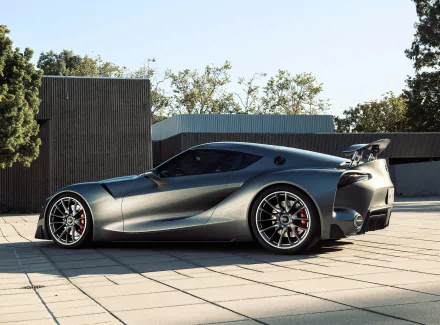 Silver Toyota FT-1 concept supercar showcased outdoors in HD, highlighting its sleek design and aggressive stance as a futuristic vehicle and desktop wallpaper.