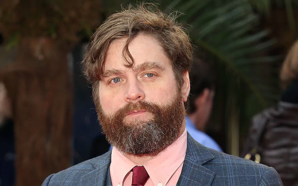 HD desktop wallpaper featuring a bearded man in a suit and tie, creating a professional and engaging background.