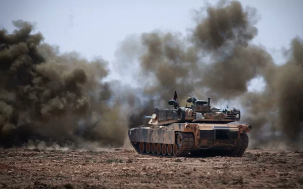 4K Ultra HD military wallpaper featuring an M1 Abrams tank advancing through a dusty battlefield with smoke clouds in the background.