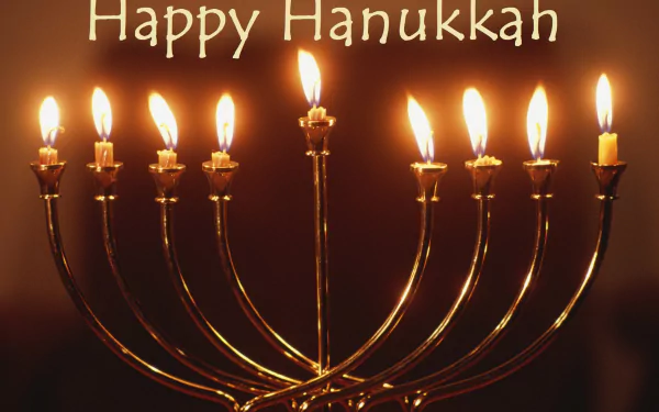 HD PC desktop wallpaper featuring a glowing Hanukkah menorah with lit candles and the text Happy Hanukkah celebrating the holiday.