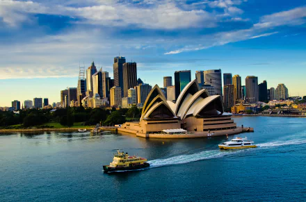 4K Ultra HD image of Sydney Opera House and the city skyline in Australia, showcasing iconic man-made architecture against a vibrant sky and harbor setting.
