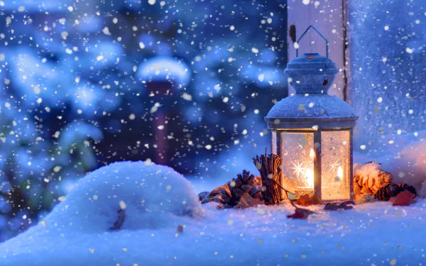 HD Christmas-themed desktop wallpaper with a glowing lantern amidst a snowy scene, featuring snowflakes and a wintery atmosphere.