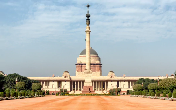 HD desktop wallpaper of the man-made Rashtrapati Bhavan, showcasing its grand architecture under a partly cloudy sky.