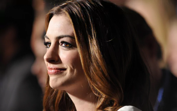 Close-up of celebrity Anne Hathaway with soft lighting, captured in a 4K Ultra HD PC desktop wallpaper and background.