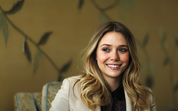 A high-definition desktop wallpaper featuring celebrity Elizabeth Olsen, smiling warmly against a softly patterned background with subtle botanical elements.