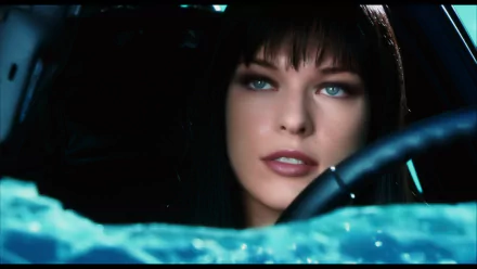 HD PC desktop wallpaper featuring a close-up of a woman with striking blue eyes from the movie Ultraviolet, set against a dark, intense background.