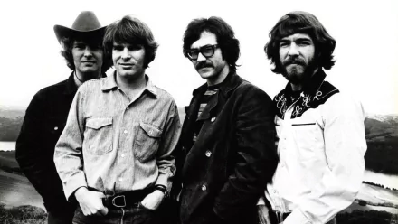 Black and white HD desktop wallpaper featuring the members of Creedence Clearwater Revival, showcasing the iconic rock band in a casual outdoor setting.