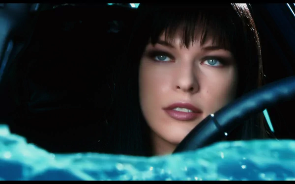 HD PC desktop wallpaper featuring a close-up of a woman with striking blue eyes from the movie Ultraviolet, set against a dark, intense background.