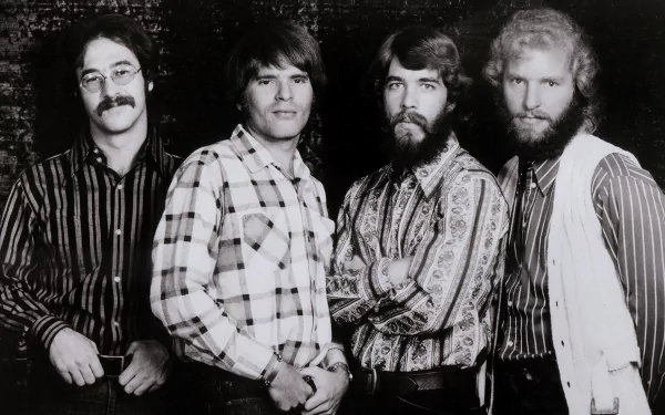 Black and white HD desktop wallpaper featuring the members of Creedence Clearwater Revival posing together in patterned shirts and vests.