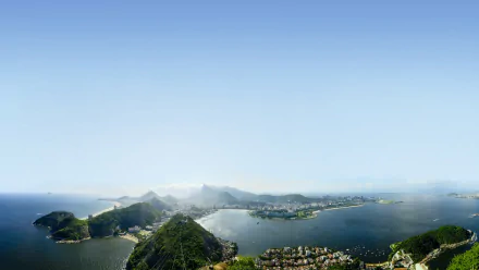 Sunlit aerial view of Rio de Janeiro, Brazil, showcasing the city's natural landscape and man-made structures in stunning 4K Ultra HD detail.