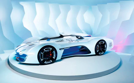 Sleek white-and-blue Alpine Renault concept car rendered as a Gran Turismo 6 video game scene, shown on a rotating platform — 2K Quad HD PC desktop wallpaper and background.