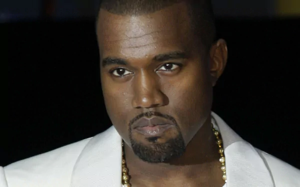 HD desktop wallpaper featuring a portrait of a man with a serious expression, wearing a white shirt and gold chain.