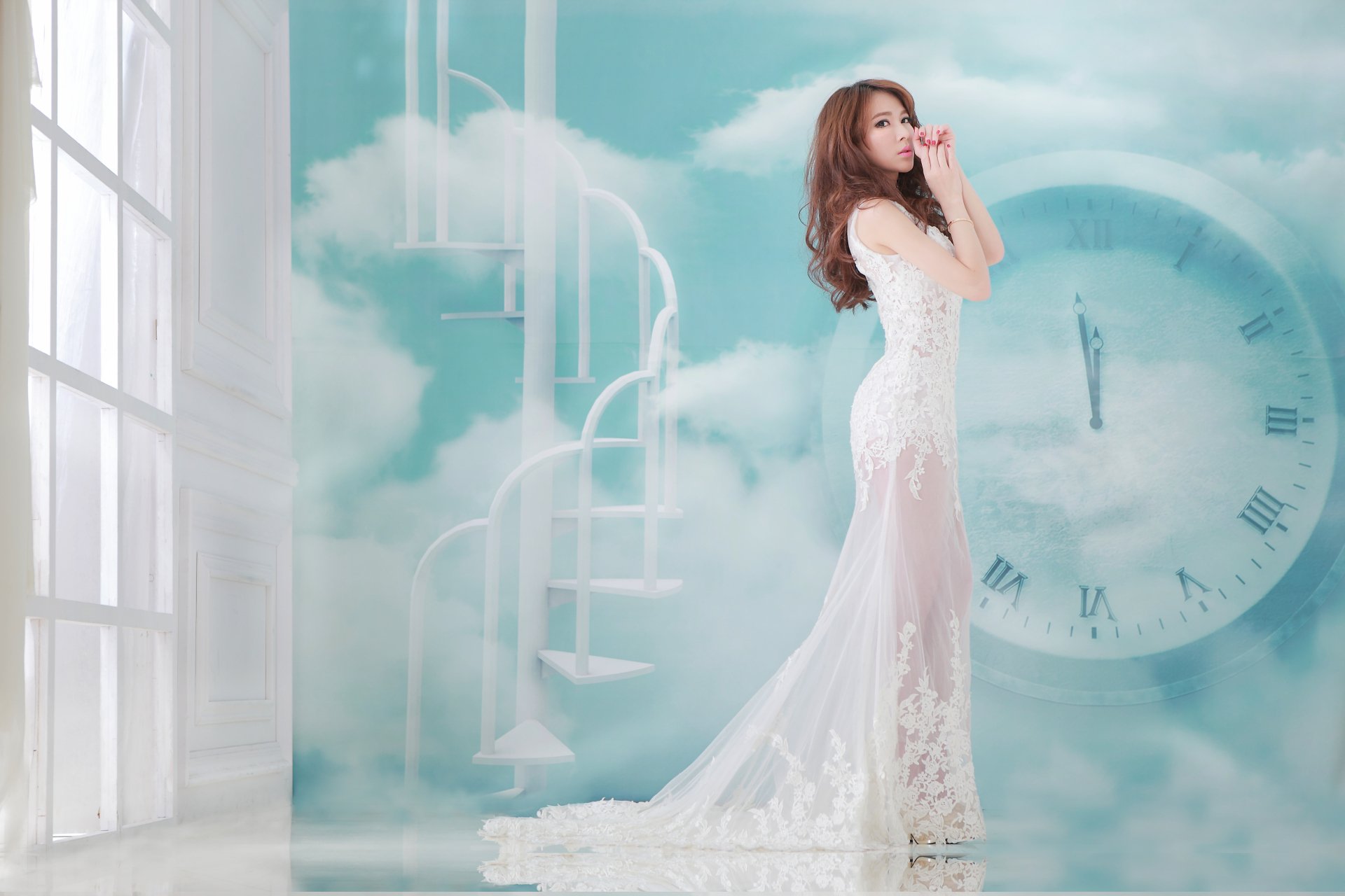 An elegant Asian woman in a white dress stands beside a window and a backdrop of stairs and a clock against a cloudy sky, embodying grace and tranquility in this high-definition Taiwanese wallpaper.
