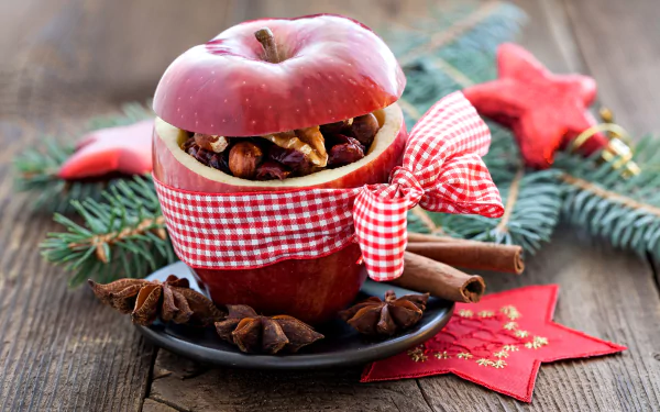 A festive holiday scene featuring a red apple filled with nuts and spices, wrapped with a checkered ribbon, set against Christmas decorations in 8K Ultra HD.