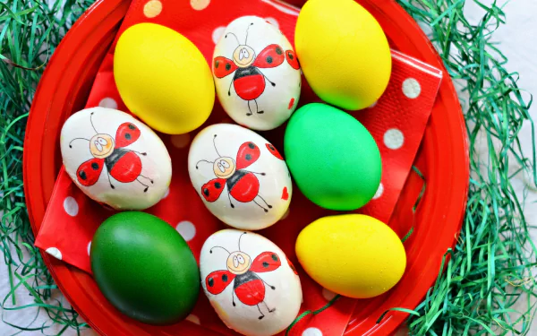 HD PC desktop wallpaper featuring colorful Easter eggs, including yellow, green, and white eggs decorated with red ladybug designs on a red plate with green grass.