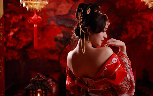 A woman in traditional Taiwanese dress elegantly poses against a rich red background, adorned with candles and decorative elements, highlighting her intricate hairstyle and cultural attire.