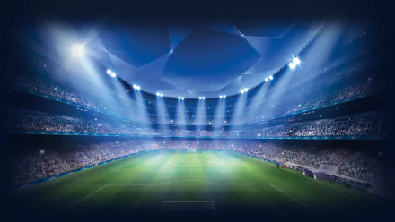 HD desktop wallpaper featuring a brightly lit soccer stadium ready for a UEFA Champions League match, capturing the excitement of sports under stadium lights.
