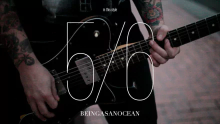 HD desktop wallpaper featuring a close-up on a guitarist from Being As An Ocean, with stylized text and a dark aesthetic.
