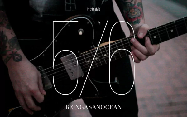 HD desktop wallpaper featuring a close-up on a guitarist from Being As An Ocean, with stylized text and a dark aesthetic.