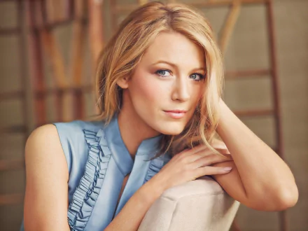 HD desktop wallpaper featuring blonde actress Blake Lively with blue eyes, posing indoors with a calm and confident expression.