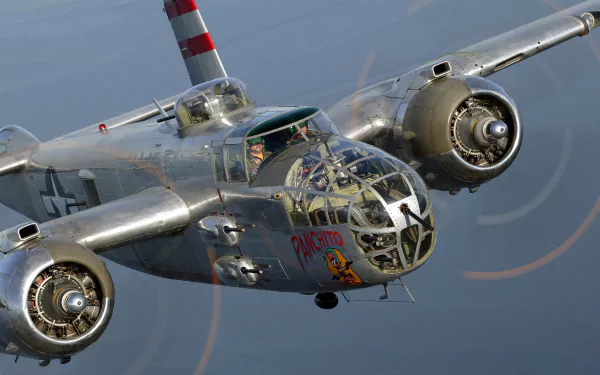 Military North American B-25 Mitchell aircraft in flight, captured in stunning 4K Ultra HD detail for a dynamic PC desktop wallpaper background.