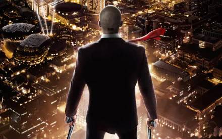 A dramatic HD wallpaper featuring the iconic character from the movie Hitman: Agent 47, poised against a vibrant city skyline, exuding a sense of power and mystery.