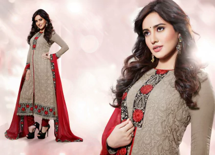 A stunning model showcases traditional Indian national dress, featuring intricate embroidery and vibrant colors, captured in high-definition for a striking wallpaper background.