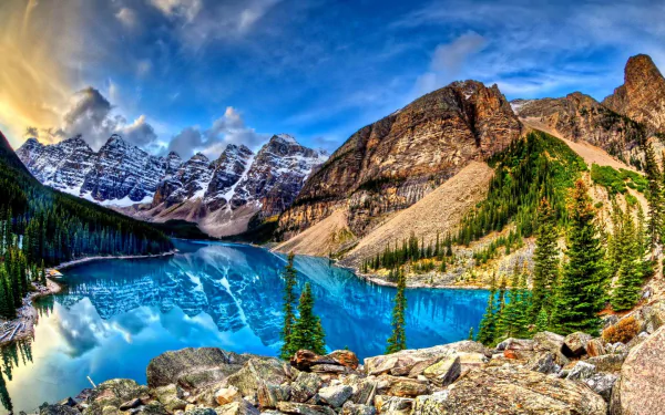A stunning view of Moraine Lake in Banff National Park, Alberta, showcasing the reflective blue waters surrounded by the majestic Rocky Mountains and lush valleys.