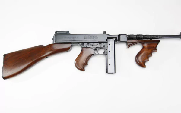 A high-definition desktop wallpaper featuring a detailed view of a machine gun with wooden accents, showcasing the craftsmanship of man-made weaponry.