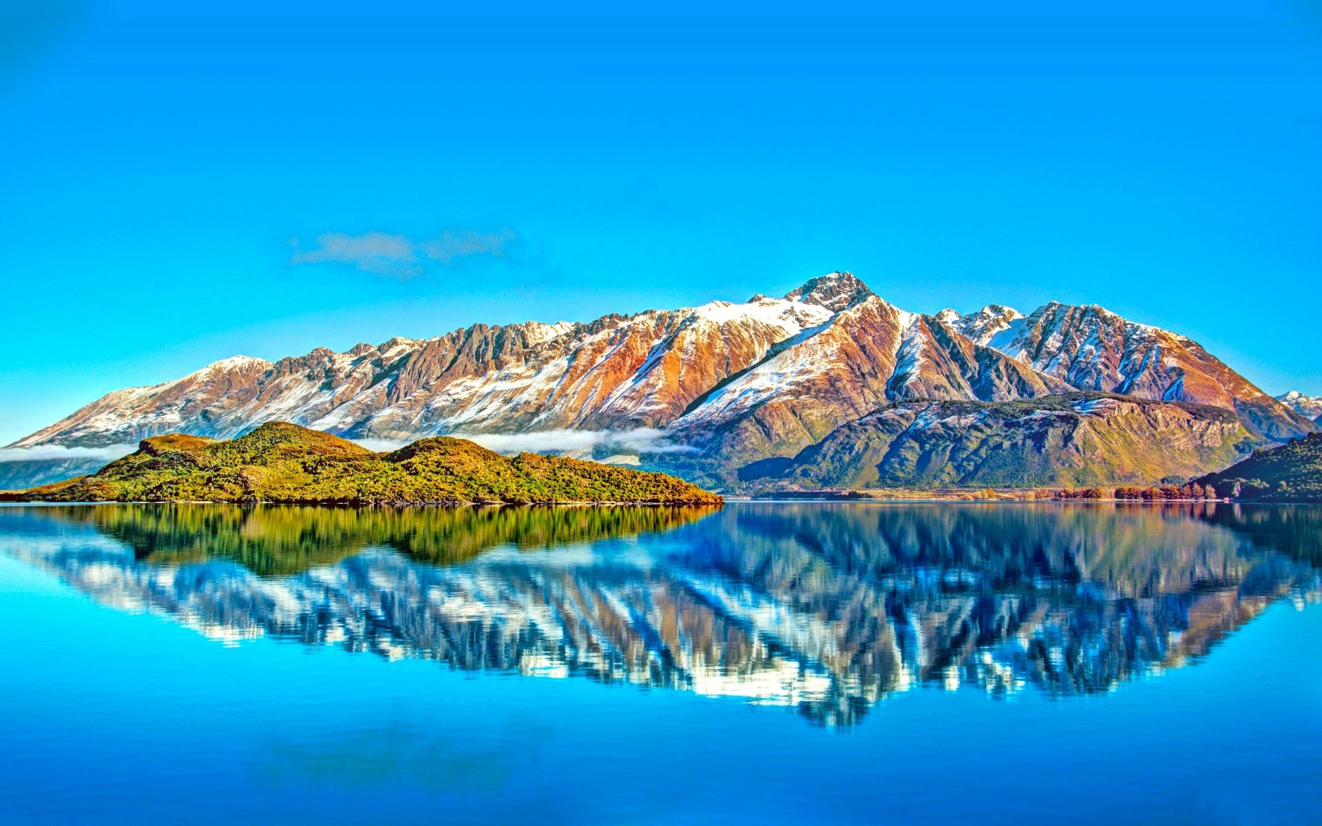 HD wallpaper featuring a vivid reflection of snow-capped mountains and trees in Lake Wanaka, capturing the serene beauty of nature.