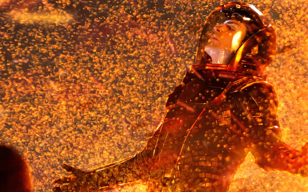 HD desktop wallpaper from the movie Star Trek Into Darkness, featuring a character engulfed in fiery sparks and intense orange lighting.