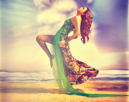 2K Quad HD desktop wallpaper showing an Indian woman in a flowing green dress leaping on a sunlit beach, warm pastel sky and gentle waves in the background.