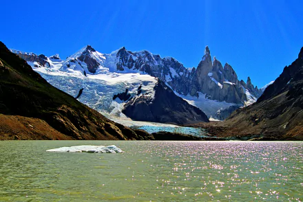 Stunning view of Cerro Chaltén and Mount Fitzroy, featuring glaciers and shimmering waters in Patagonia, Argentina, capturing the essence of nature's beauty.