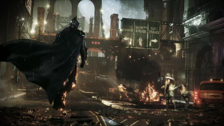 HD desktop wallpaper featuring Batman from the video game Batman: Arkham Knight, showing an intense urban scene at night with lit signs and debris.