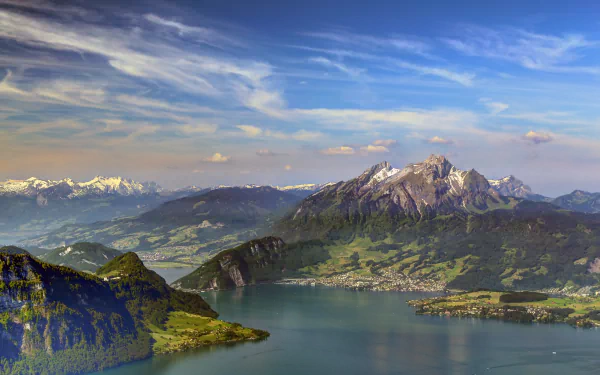 A stunning view of Mount Pilatus in Lucerne, Switzerland, featuring lush landscapes under a vibrant sky, captured in vivid detail for a breathtaking 4K Ultra HD wallpaper.