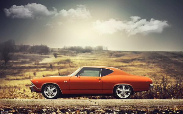 An orange Chevrolet Chevelle SS muscle car parked on a scenic road, set against a dramatic sky, showcasing its classic design and bold character.