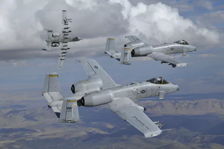 Three Fairchild Republic A-10 Thunderbolt II warplanes navigate through a cloudy sky, showcasing their military design in this striking 4K Ultra HD wallpaper.