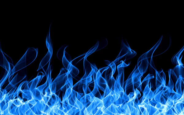 A vibrant display of blue flames against a black background, creating an artistic and mesmerizing HD wallpaper for PCs.
