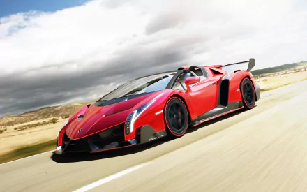 A striking Lamborghini Veneno Roadster in vibrant red speeds along an open road, showcasing its sleek design and powerful presence in this HD desktop wallpaper.